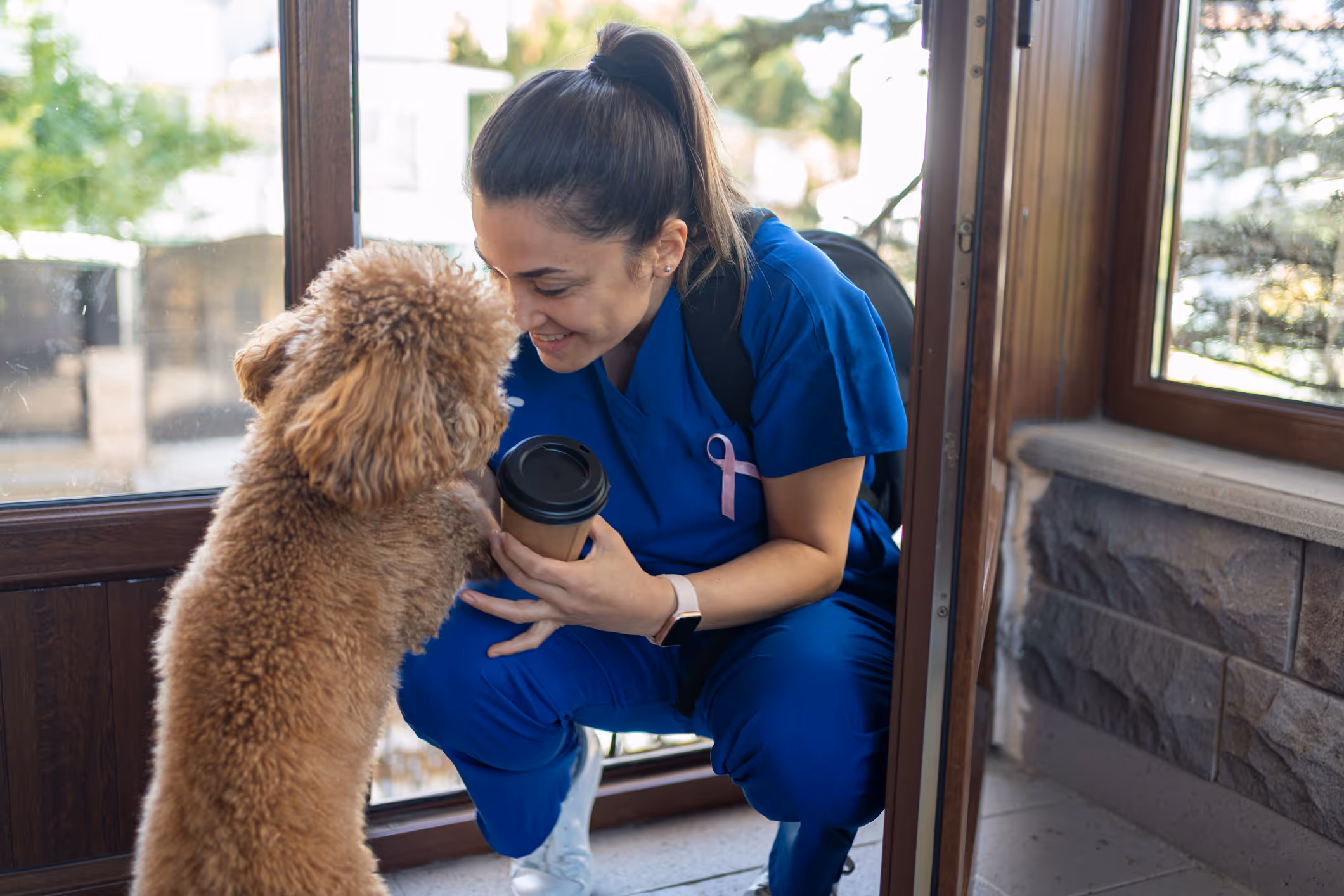 Homelove caregiver with a happy dog